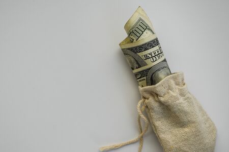 Money bag with dollars isolated on white background, business finance. save money for investment concept money bag, copy spaceの写真素材