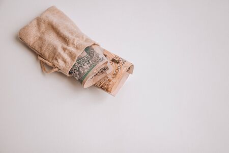 polish zloty currency, poland money on the white background, one and two hundred polish cash in...