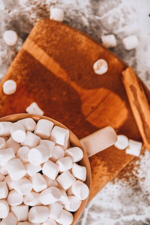 a cup of Christmas New Year delicious hot chocolate and cocoa with marshmallows sprinkled with cocoa...