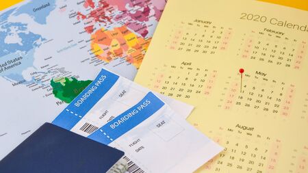 passport, boarding pass over map. travel concept., on calendar with pins Passport on map ticket, planning tripの写真素材