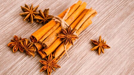 Cinnamon and star anise on wooden background, Herbs and Spices over wooden background, christmas...