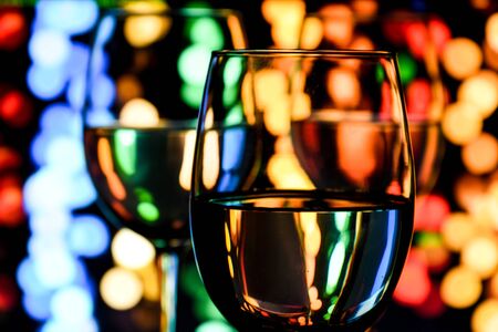 wine glasses side by side on coloured light background, selective focus, Set of wine glasses with white and rose wine, bannerの写真素材