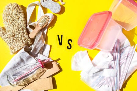 Zero waste eco friendly reusable objects such as reusable linen shopping bags, glass jars and wooden hairbrush vs plastic single-use objects, drinking straw, food containerの写真素材