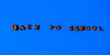 quick breakfast of chocolate flakes in the shape of letters from which is laid out Back to school....