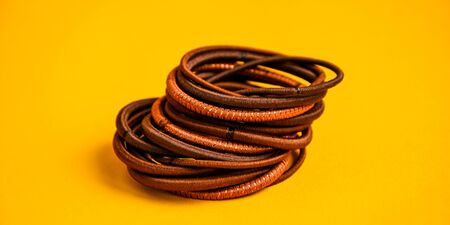 scrunchy for hairdresser on yellow background with copy space, set of hairdresser toolsの写真素材