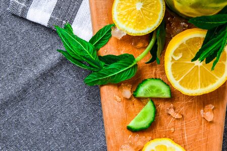 Fresh cool lemon cucumber mint infused water detox drink, summer refreshing drink, organic vegan beverage, selective focus, top viewの写真素材