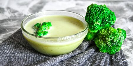 Broccoli, spinach cream soup in a bowl, close up, Selective focus, copy space for text, Vegetarian vegan broccoli cream soup, Healthy eatingの写真素材