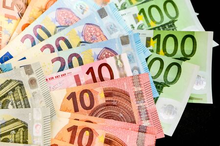 pile of paper euro banknotes as part of the united country's payment system, Euro European currency - money, top view, Euro Money. euro cash backgroundの写真素材