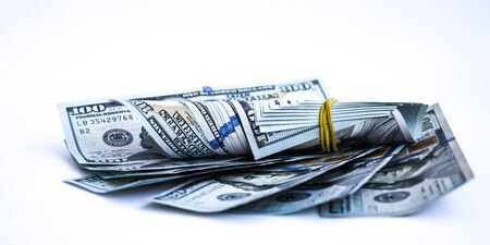 Bag with money isolated on white, Hundred dollar bills in a canvas sack, Banknotes money dollars in the bag, copy space for textの写真素材