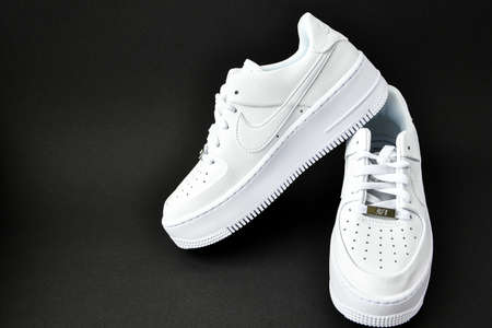 Zhytomyr, Ukraine - June 1, 2020: Nike Air Force 1 Sage white sneakers product shot on black background. Illustrative editorial photo. Sport footwearのeditorial素材