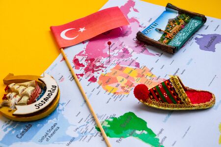 Turkey travel concept, turkish flag, magnets from Halfeti and Sanliurfa, world map, passport, boarding passの写真素材