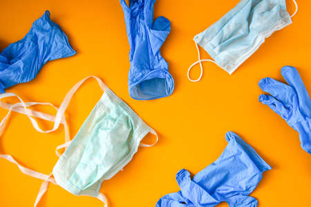COVID-19 Medical Waste. Disposal of gloves, masks. Used personal protective equipment PPE. Plastic pollution after the pandemic. Coronavirus plastic trashの写真素材