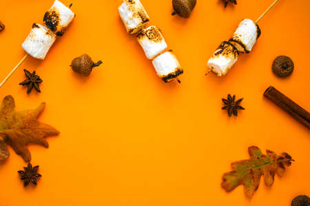 Christmas composition. Cinnamon marshmallows leaves and anise on yellow background. Fall composition. Pattern made of autumn things. Flat lay. Ornament For Thanksgiving. Autumn Frame with Copy space.の写真素材
