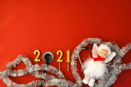 2021 year made of gold candles with medical stethoscope. Copy space. New year and Merry christmas...