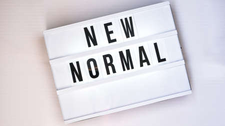 Lightbox with text NEW NORMAL. Back to school. Social distancing. School quarantine concept. Copy space. Coronavirus second waveの写真素材