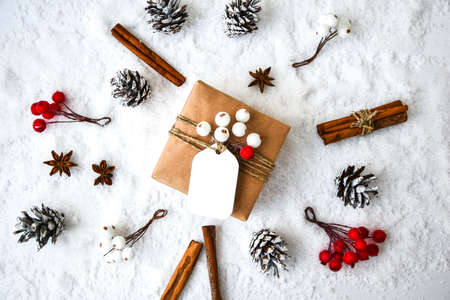 Zero waste Christmas presents with decorations on white snow background. Copy space. Eco friendly...