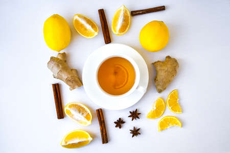 Trendy flat lay Ginger hot immunity boosting Vitamin natural drink With citrus lemon cinnamon anise...