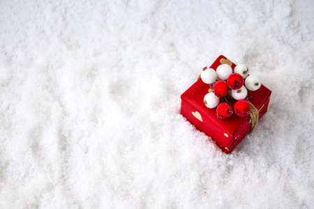 Zero waste Christmas presents with decorations on white snow background. Copy space. Eco friendly packed gift with tags from craft cardboard. New yearの写真素材