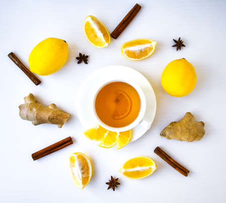 Trendy flat lay Ginger hot immunity boosting Vitamin natural drink With citrus lemon cinnamon anise...