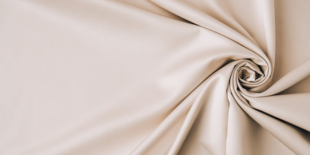Gray fabric pattern background, design waving gray fabric texture background. Champagne colored golden mooth silk or satin texture. Copy space for text. Texture backgroundの写真素材