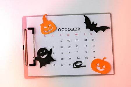Calendar 31st of October date. Halloween background. Planning party. Autumn holidays. Flat lay. Top view. Halloween bat, pumpkin ghost decorations.の写真素材