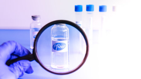 Kiev, Ukraine 8 February 2021 Ampoules Covid-19 vaccine developed by Pfizer and BioNTech on a...