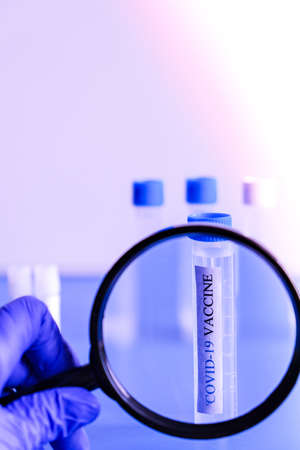 Ampoules Covid-19 vaccine on a laboratory bench. Fight the coronavirus, sars-cov-2 pandemic....