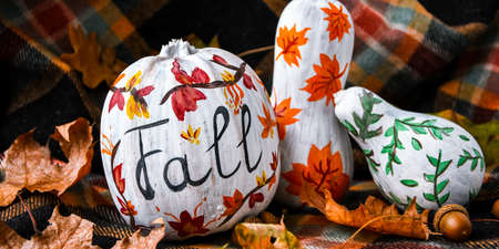 Beautiful painted autumn pumpkins. FALL writing on pumpkin. Autumn harvest. DIY. Autumn leaves...