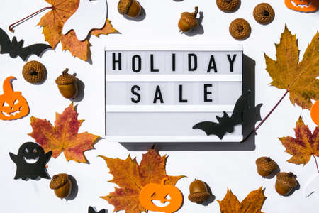 Lightbox with text HOLIDAY SALE, Halloween autumn leaves decorations Sale shopping concept. Online shopping Template Black friday sale mockup fall thanksgiving promotion advertising Big sale. Cyber monday. Holidayの写真素材