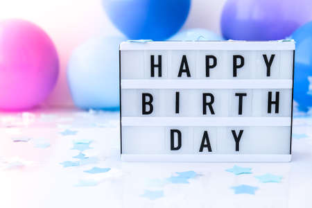 Lightbox with text HAPPY BIRTHDAY on Abstract defocused blurred festive background for holiday. Blue...