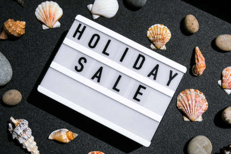 Lightbox with text HOLIDAY SALE, summer decorations Sale shopping concept. Mockup summer promotion advertising. Holiday. Sea shell starsの写真素材
