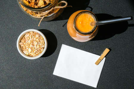 Seasonal pumpkin carrot smoothie drink detox with eco metal drinking straw Glass jar granola muesli oatmeal breakfast. Paper note. Clean eating, weight loss, healthy dieting food concept Fruit vegetable drink fitnessの写真素材