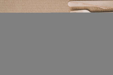 Eco friendly fast food containers. Wooden forks and knives. Eco friendly disposable tableware. Used in fast food, restaurants, takeaways, picnics. No plastic zero wasteの写真素材
