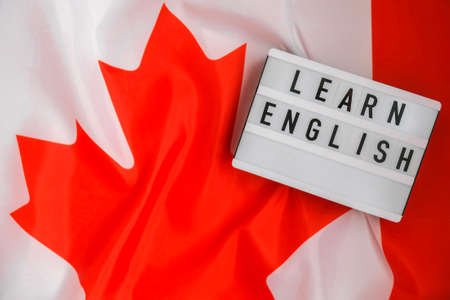 The National Flag of Canada. Lightbox with text LEARN ENGLISH Canadian Flag or the Maple Leaf....