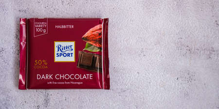 Kiev Ukraine - October 2021 DARK CHOCOLATE taste. Chocolate Ritter Sport bar German chocolate, different types tastes. Square chocolate Bar made by Alfred Ritter GmbH Co. Sweet sugar foodのeditorial素材
