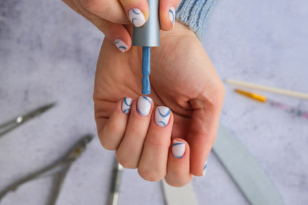 Professional stylish trendy blue Hardware Manicure. Procedure for the preparation of nails. Top view flat lay. Self care. Spa, beautician advertisement.の写真素材