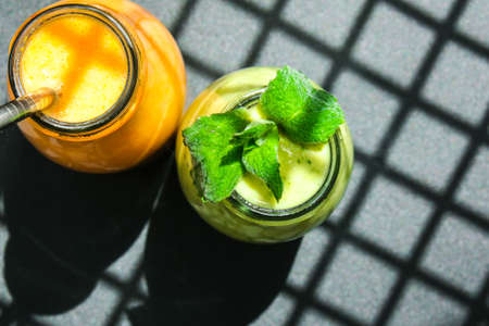 Seasonal Matcha green vegan smoothie with chia seeds and mint pumpkin carrot smoothie drink detox...