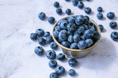 Fresh blueberries background with copy space for your text. Blueberry antioxidant organic superfood in a bowl concept for healthy eating and nutrition. Harvesting conceptの写真素材