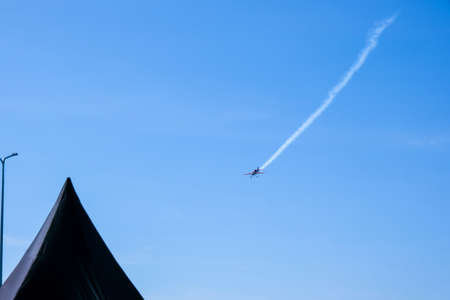 Overhead flying aircraft. Aircraft in formation during an aerobatics display as they loop and roll...