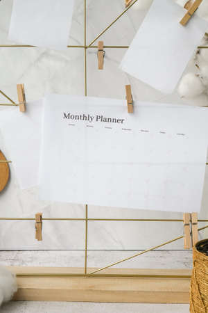 MONTHLY PLANNER Cards and posters mock ups on grid board. copyspace. home office desktop. Freelance bloggers workplace. Brushes and palette tools Creativeの写真素材