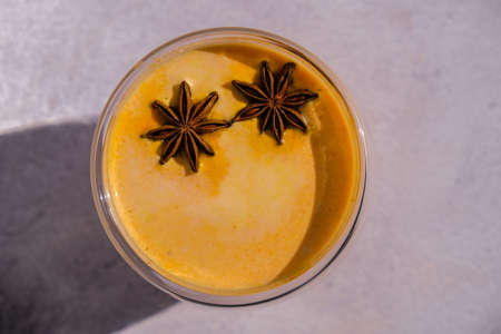 Pumpkin smoothie spiced latte. Anise stars. Autumn coffee with spicy pumpkin flavor seasonal hot drink. Fall Drinks for Halloween and Thanksgivingの写真素材