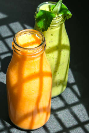 Seasonal Matcha green vegan smoothie with chia seeds and mint pumpkin carrot smoothie drink detox...