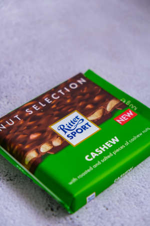 Kiev Ukraine - October 2021 CASHEW taste. Nut selection Chocolate Ritter Sport bar German chocolate,...