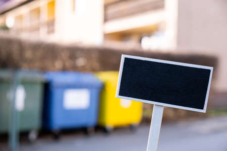 Empty mockup template Blackboard label against Color container for separate collecting garbage. Recycling of garbage separation and recycling. Garbage trash bins for waste segregation. Separate waste collection food waste, plastic, paper and danger waste Environmentの写真素材
