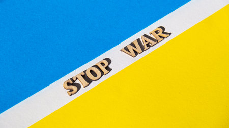 Ukrainian national flag made of paper. STOP WAR text. The concept of ending the war in Ukraine. National symbol - blue and yellow. War Protest against Russian invasion of Ukraine. Banner sizeの写真素材