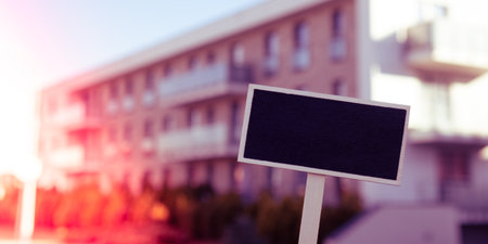 Blank Black billboard against new apartment building Empty mockup template Blackboard label Home for...
