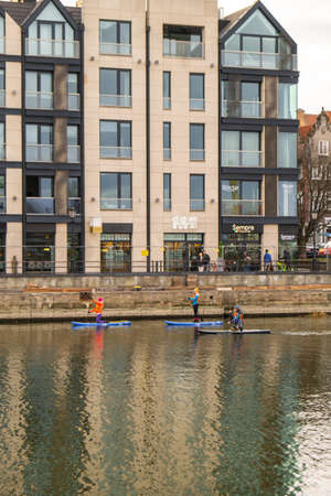 Gdansk Poland March 2022 Group of sup surfers stand up paddle board, women stand up paddling...