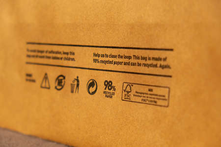 Recycling bag Closeup view of pap sign and other eco-label on Brown paper bag that is 100 recyclable...