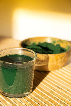 Blue-green algae Chlorella and spirulina powder. Super powder. Natural supplement of algae. Detox superfood drink cocktail. Food supplement source of protein and beta caroteneの写真素材