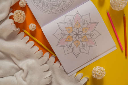 Mandalas antistress page to combat stress. Relaxing hobby mental wellbeing and art therapy. Meditative process of coloring pages. Self expression by artの写真素材